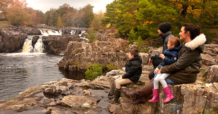 family sat watching Low Force Waterfall